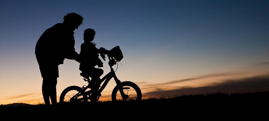 Photo of kid riding bike